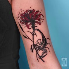 a woman's arm with a tattoo on it and a flower in the center