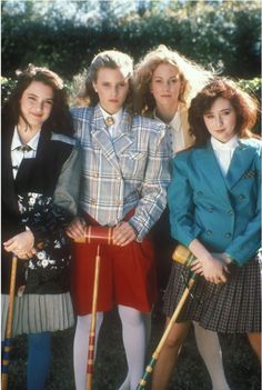 a group of young women standing next to each other