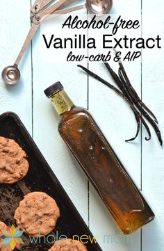 a bottle of vanilla extract next to some cookies