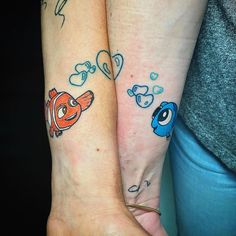 two people with matching tattoos on their arms