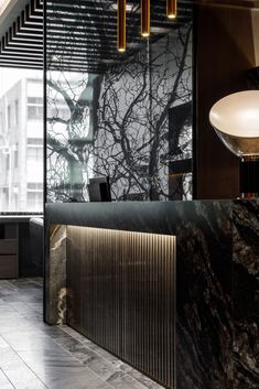 an office lobby with marble walls and flooring