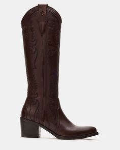 Expertly crafted for Western-style and durability, our SALOON boots feature a pointed toe, knee-high silhouette, and whipstitching detailing. The sturdy block heel with a star detail adds a touch of unique charm while providing comfortable support. Elevate your wardrobe with these timeless, versatile boots. 2.5 inch heel height 14.25 inch shaft circumference 12.25 inch shaft height Leather upper material Leather lining Leather sock Synthetic sole Fit tip: If you are in between sizes, size up a half-size Imported Summer Wardrobe Staples, Western Boots Women, Leather Wear, Leather Socks, Western Boot, 5 Inch Heels, Women's Boots, Western Style, Unique Charms