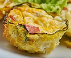 an omelet on a plate with lettuce