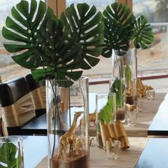 a table with vases filled with plants on top of it, and an instagramr