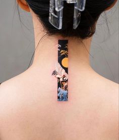 a woman with a tattoo on her back neck