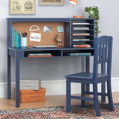 a blue desk with a chair next to it