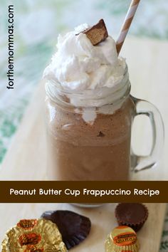 there is a chocolate drink with whipped cream on top and some candy in the bottom