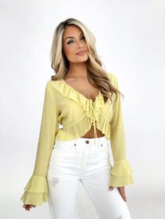 Indulge in the luxurious elegance of our Striking Essence Top. Featuring a flattering v neckline, delicate front tie, and cascading ruffled details, this cropped top is perfect for making a statement. The bold and bright color, with textured fabric and flared sleeves, exudes an elevated and trendy style. Stay comfortable and chic this spring and summer, whether for a dinner, drinks, or vacation. Shell 75% Rayon 25% Polyester Hand wash cold. Dinner Drinks, Trendy Style, Girly Outfits, Textured Fabric, Chiffon Top, Cropped Top, Bright Color, Flared Sleeves, Chiffon Tops