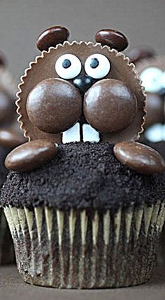 a cupcake with chocolate frosting and eyes on it