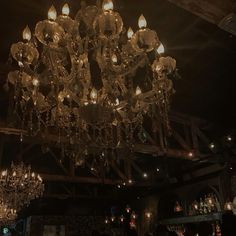 a chandelier hanging from the ceiling in a dark room