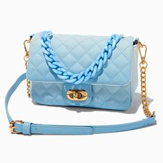 This crossbody purse features a gold-tone buckle that opens wide for easier access to your essentials. The ombre bag is decorated all over with a quilted design, and comes with a gold-tone chain and crossbody strap.8W x 6H x 2D in.20.32W x 15.24H x 5.08D cm.Hardware Finish: Gold-toneClosure: BuckleMaterial: PU - Claire's Blue Ombre Quilted Crossbody Bag Chic Blue Quilted Shoulder Bag, Blue Quilted Crossbody Bag, Trendy Blue Quilted Bag, Chic Blue Quilted Bag, Ombre Bag, Piercing Kit, Blue Handbags, Blue Purse, Fashionable Jewelry