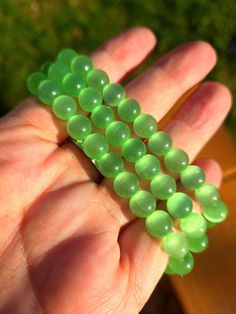 This listing is for (1) green selenite bracelet in 8mm size for average size wrists this is a stretch bracelet  What is the spiritual meaning of this crystal? Green Selenite, a variation of the mineral gypsum, is often associated with the heart chakra and is believed to promote emotional balance and spiritual growth. Its coloration, ranging from pale to vibrant green, symbolizes renewal and the flourishing of life, akin to the verdant hues of nature in spring. In spiritual practices, green selenite is said to facilitate inner peace, offering a calming presence that can aid in meditation and the release of negative energy. It is also thought to enhance one's connection to the natural world, encouraging a deeper appreciation for the earth and its bounty. As with all selenite, it is believed Selenite Bracelet, Selenite Stone, Crystal Green, Selenite Crystal, Spiritual Meaning, Emotional Balance, Energy Field, Spiritual Gifts, Spiritual Practices