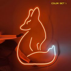 a neon fox sitting on top of a table