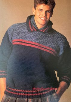 a young man wearing a blue sweater with red and black stripes