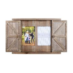 an old wooden box with two pictures in it