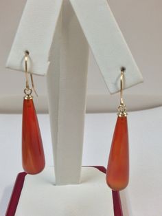 "SOLID 14KT YELLOW GOLD DANGLE EARRINGS NATURAL CARNELIAN IS  30 x 8 mm EACH (26.00 Tcw) EARRING LENGTH IS 1.75\" INCHES WITH GIFT BOX" Orange Teardrop Jewelry For Formal Occasions, Formal Gold Carnelian Jewelry, Orange Drop Earrings For Formal Occasions, Classic Yellow Gold Carnelian Jewelry, Classic Carnelian Yellow Gold Jewelry, Gold Carnelian Jewelry With Matching Earrings, Gold Carnelian Teardrop Jewelry, Elegant Gold Carnelian Earrings, Carnelian Dangle Earrings