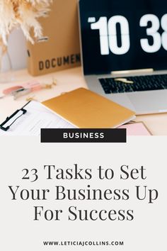 a laptop computer sitting on top of a desk with the words, 23 tasks to set your business up for success