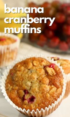 banana cranberry muffins on a plate with strawberries in the background