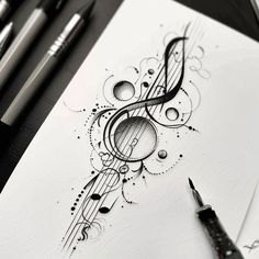 an ink drawing with music notes on it and some pens in front of the paper