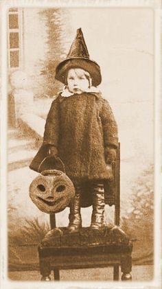 an old photo of a little boy dressed as a witch