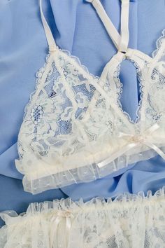 Elevate your bridal glow and slip on ourlLacy ruffle triangle bralette. A confidence-boosting bralette every bride deserves. 💍 Feminine Wedding Bra With Delicate Lace, Feminine Cream Lace Bra, Party Lace Bra With Delicate Straps, Fitted Lace Trim Bra For Wedding, Fitted Wedding Bra With Lace Closure, Elegant Lace Bra For Wedding Night, Delicate Lace Wedding Bra, Delicate Fitted Wedding Bra, White Delicate Wedding Bra