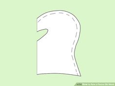 the outline of a paper mask on a green background