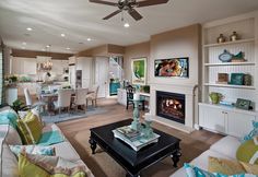 a living room filled with furniture and a fire place