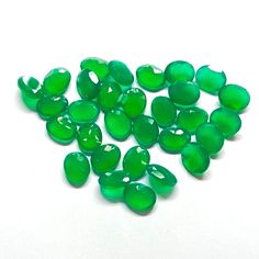 green glass beads on a white background