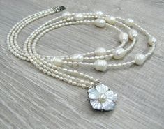 "Triple pearl necklace, layering multi strand necklaces, Mother's day gift, gift for bride, wedding pearl jewelry, white rice pearls, freshwater pearls. Length: 17.5\" or 44 cm by shorter strand. Please see photos on the model. Small rice shaped freshwater pearls measure 3X4 mm, they are white color with cream overtone, lustrous. You can see they are made by nature, because every bead has its own individuality, no 2 beads look alike. I used larger rice shaped freshwater pearl beads for the centr Pearl Necklace Layering, Multi Strand Necklaces, Wedding Pearl Jewelry, Rice Pearls, Pearl Jewelry Wedding, Gift For Bride, Jewelry White, Necklace Layering, White Rice