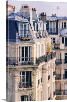 an apartment building with balconies and balconyes in paris, france canvas wall art print