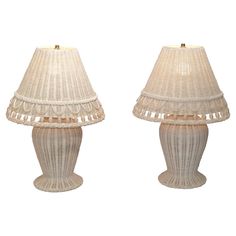 two white lamps sitting next to each other