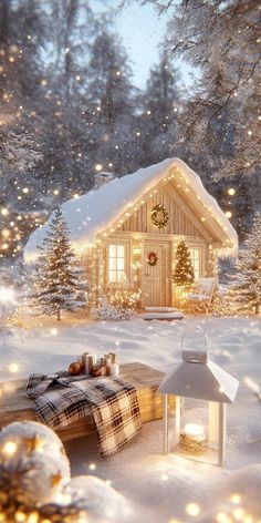 a christmas scene with a small cabin in the snow