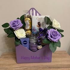 a mother's day gift basket with purple roses