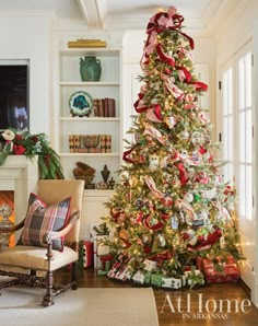 a decorated christmas tree with presents under it