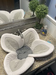 a sink that has been made into a flower shaped seat for someone to sit in