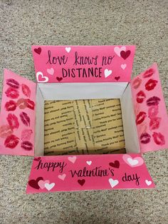 a valentine's day card in a box on the floor