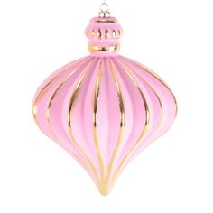 a pink and gold ornament hanging from a chain