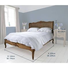 a bed with measurements for the frame and headboard, along with an end table