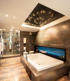 a bathroom with a large jacuzzi tub next to a walk - in shower