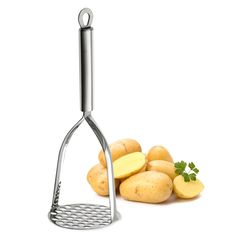 potato grater and potatoes on a white background