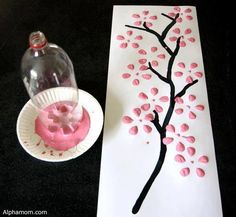 a paper plate with pink icing on it next to a painting and a vase