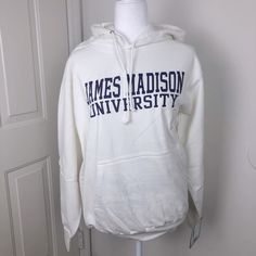 Brand New With Tags! Officially Licensed White Hooded Sweatshirt With James Madison University Logo On The Front. Front Pocket And Drawstring Closure. Lettering Is In The Jmu Purple Hue, Even Though It Looks A Little Darker In The Photos. Bought From The University Bookstore. Size Small: Approximately 25” Long And 20” From Pit To Pit White Hoodie For College In Fall, White Winter Hoodie For College, White Hooded Top For College, Collegiate White Hoodie For Fall, White Collegiate Hoodie For Fall, White Varsity Sweatshirt For Winter, Collegiate White Crew Neck Hoodie, White Collegiate Hoodie With Crew Neck, White Collegiate Crew Neck Hoodie