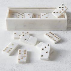 marble dominos with gold dots in a box