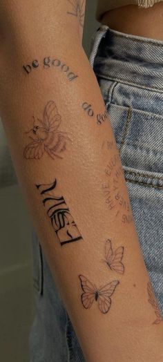 a woman's arm with butterflies and the words hello written on it, in cursive writing