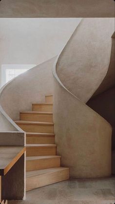 the stairs are made of concrete and wood