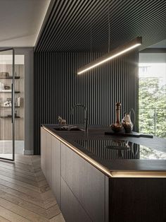 a modern kitchen with black and gold accents