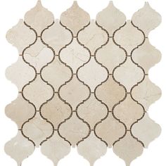 a white and brown tile with an intricate design