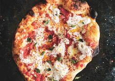 a pizza sitting on top of a pan covered in cheese