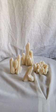 several pieces of peeled bananas sitting on top of a bed