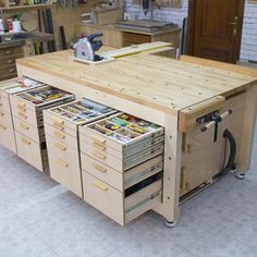 a workbench with lots of drawers and tools